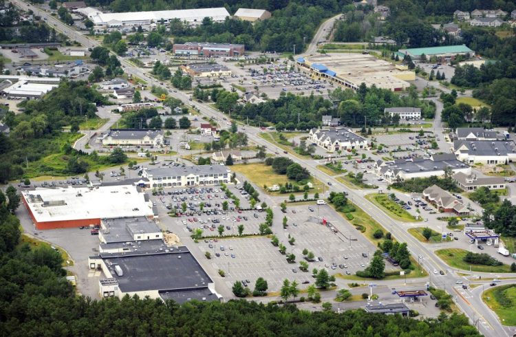 A 2012 aerial view shows the Falmouth Shopping Center in the foreground on the left side of Route 1, looking toward Portland. "It is our understanding," said Town Council Chairman Caleb Hemphill, "that the alternative plan is not at all the preferred development option, and that the developer is still looking to build out the original plan."