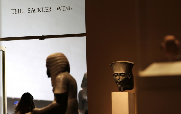 A sign with the Sackler name is displayed at the Metropolitan Museum of Art in New York. The Sackler name adorns walls at some of the world's top museums and universities.