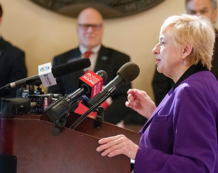 Gov. Janet Mills speaks at a news conference Tuesday at the State House. She said, "It is time we build more affordable housing for seniors just as the voters intended."