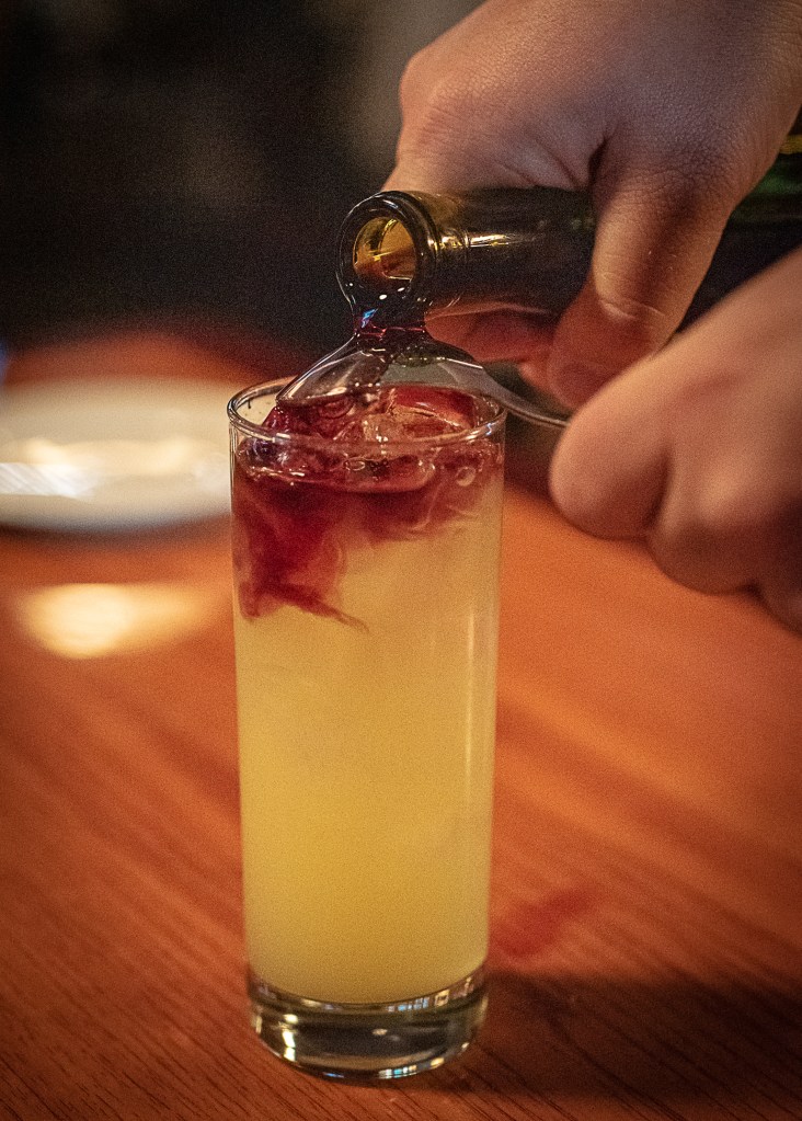 The “LA Sour” is a Cowbell house cocktail of bourbon, sour mix and a measure of red wine floating on the top.