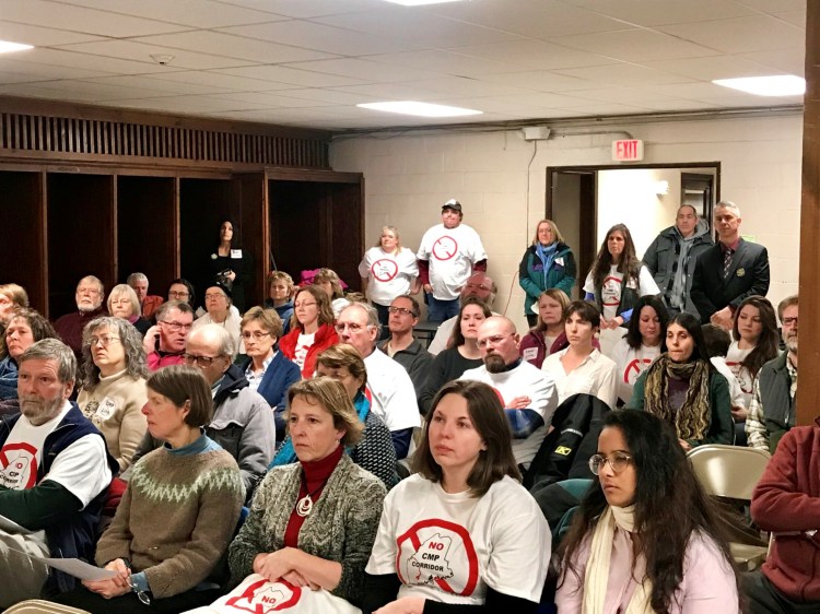 About 100 people attended a Farmington Board of Selectmen's meeting on Tuesday, Feb. 27, 2019, many of whom wore t-shirts that read, "NO CMP Corridor" and voiced opposition to a new transmission line through western Maine proposed by Central Maine Power.