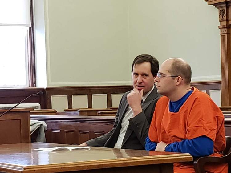 Zachary Titus, right, listens to his attorney Jeremy Pratt before the start of a hearing Monday, Feb. 4 in Knox County Superior Court.
