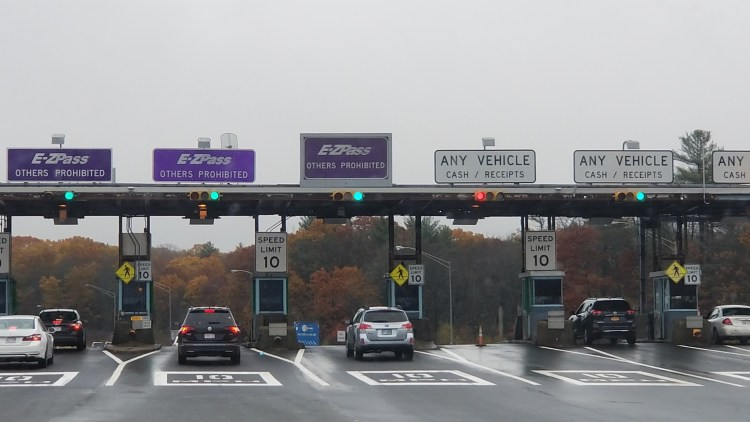 Cars pass through the York tolls on the Maine Turnpike in this file photo from March 2019. The Maine Turnpike Authority plans to increase tolls at its York Toll Plaza from $3 to $4 for cash payers.