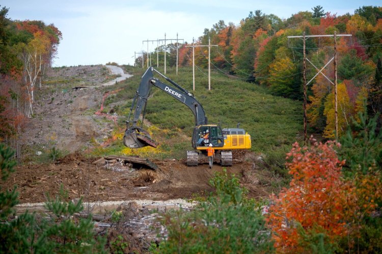 Construction crews widen the existing CMP transmission line corridor near the Wyman Dam on the Kennebec River in Bingham on Oct. 12.