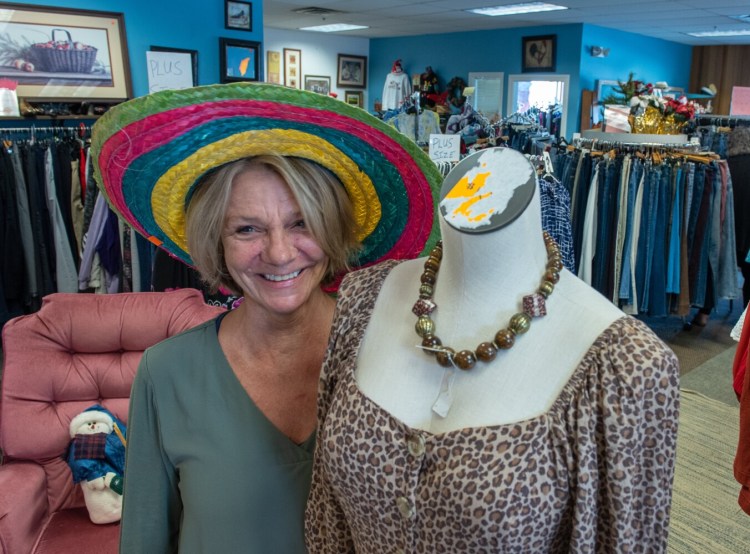 Debra York stands Friday afternoon inside An Angel's Wing on Lisbon Street in Lewiston. The nonprofit's store sells donated upscale new and used fashion articles and collectibles to benefit rehabilitation for people with substance use disorder.