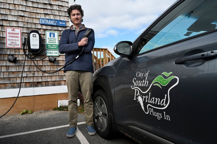 SOUTH PORTLAND, ME - OCTOBER 28: Sustainable transportation coordinator Cashew Stewart at the charging station outside the planning department in South Portland Thursday, October 28, 2021. (Shawn Patrick Ouellette/Staff Photographer)