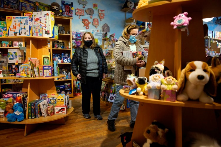 Teresa Lynch of Old Orchard Beach and Paula Demers of New Hampshire shop at Treehouse Toys in Portland's Old Port on Friday. Supply chain disruptions and staffing shortages could lead to holiday shopping hassles this season.