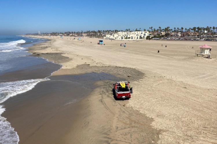 Few people visit Sunday, a week after the ocean was closed to surfing and swimming due to an offshore pipeline leak in Huntington Beach, Calif.