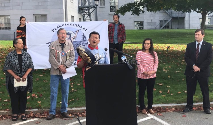 Dwayne Tomah, a language keeper with the Passamaquoddy Tribe, addresses a  rally at the State House in Augusta on Monday. Standing behind Tomah from left is Rep. Rachel Talbot Ross, D-Portland, Darrell Newell, vice chief of the Passamaquoddy Tribe at Indian Township, Ambassador of Penobscot Nation Maulian Dana and state Senate President Troy Jackson, D-Allagash.