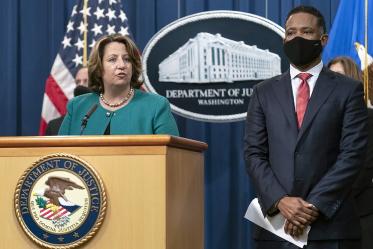 Deputy Attorney General Lisa Monaco, with Assistant Attorney General Kenneth Polite Jr. of the Justice Department's Criminal Division, speaks at the Department of Justice in Washington on Tuesday.

