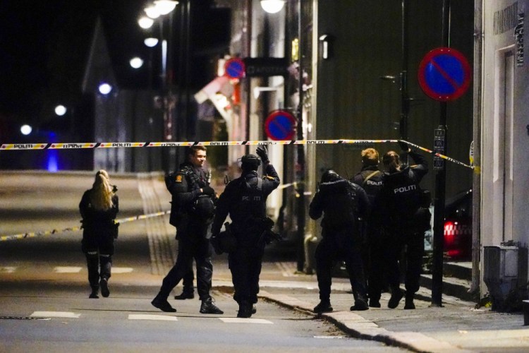 Police stand at the scene after an attack in Kongsberg, Norway, on Wednesday. 