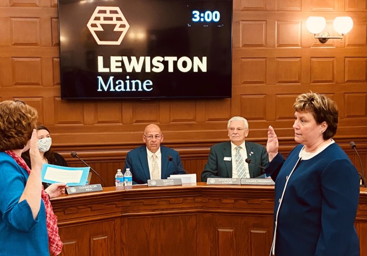 Heather Hunter, right, is sworn in Tuesday as Lewiston's new city administrator. Hunter was made interim city administrator July 28 and applied for the permanent role.