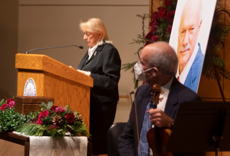 PORTLAND ME: NOVEMBER 06:  A portrait of Maine business icon David Flanagan is displayed as Governor Janet Mills speaks at a memorial service in his honor at USM’s Hannaford Hall in Portland on Saturday November 6, 2021. (Photo by Carl D. Walsh/Staff Photographer)