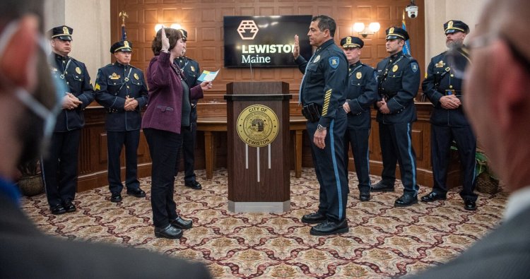 Lewiston City Clerk Kathy Montejo, front left, swears in Lewiston's new police Chief Dave St. Pierre, front right, Tuesday night in council chambers.