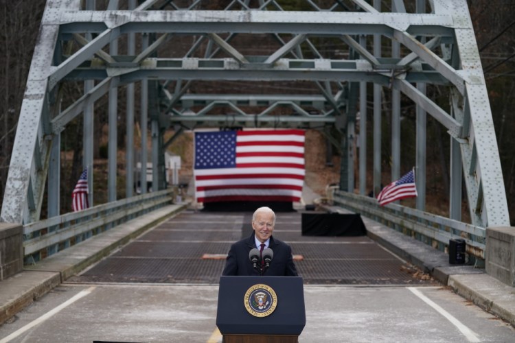 President Biden speaks during a visit to the Route 175 bridge over the Pemigewasset River  to promote infrastructure spending Tuesday, in Woodstock, N.H.