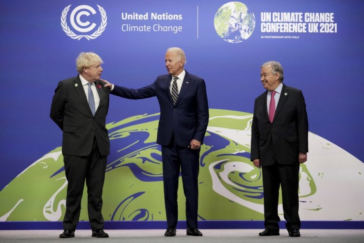 British Prime Minister Boris Johnson, left, and UN Secretary-General Antonio Guterres, right, greet U.S. President Joe Biden , at the COP26 U.N. Climate Summit in Glasgow, Scotland, Monday, Nov. 1. 