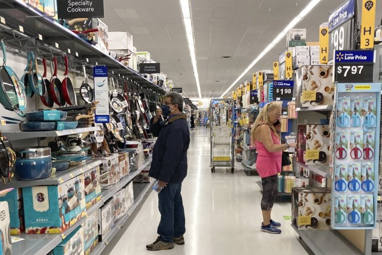 Consumers shop at a Walmart store in Vernon Hills, Ill., Sunday, May 23, 2021. 