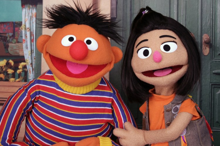 Ernie, a muppet from the popular children's series "Sesame Street," appears with new character Ji-Young, the first Asian American muppet, on the set of the long-running children's program in New York on Nov. 1, 2021. Ji-Young is Korean American and has two passions: rocking out on her electric guitar and skateboarding. 