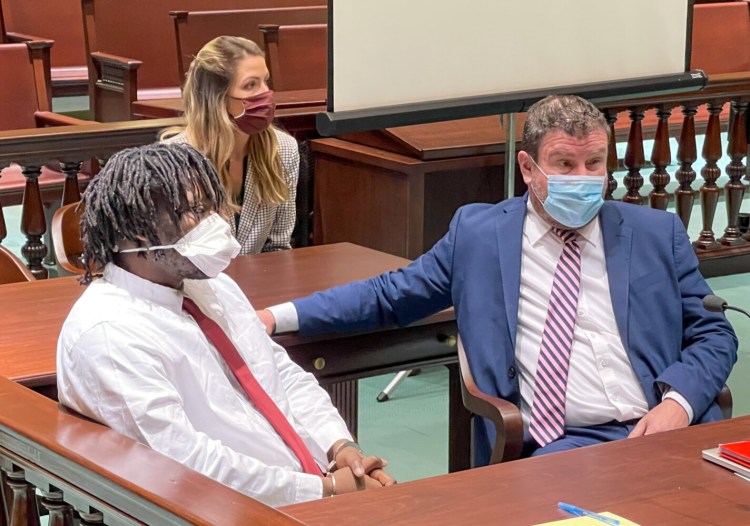 Nathaniel Ashwood of Springfield, Massachusetts, sits Monday in Androscoggin County Superior Court in Auburn where he pleaded guilty to charges from a 2020 shooting in Lewiston. Next to him is defense attorney Verne Paradie and behind them is Katie Randall, Paradie's legal assistant at his Lewiston law firm.