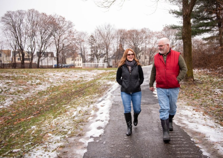 Darlene Conant, left, who founded Salt & Light Community Center, walks through Chestnut Park in Auburn on Thursday with board member Bob McLaughlin. The organization hosts many events in the park and has plans to open a physical location in the Hampshire St. neighborhood