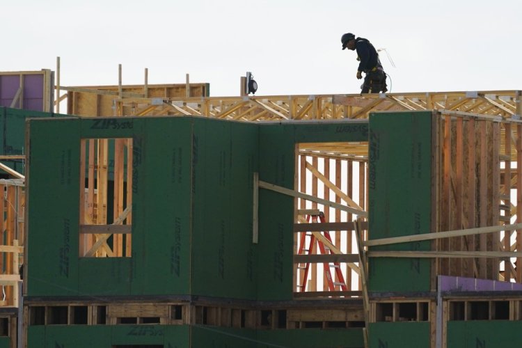 A builder works on a new home in Philadelphia on Nov. 17.