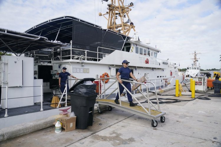 Crew members of the Coast Guard cutter William Flores get ready to go on patrol on Wednesday in Miami Beach, Fla. Crews were searching for searched for 38 people missing off the coast of Florida, four days after a suspected human smuggling boat capsized in a storm. 