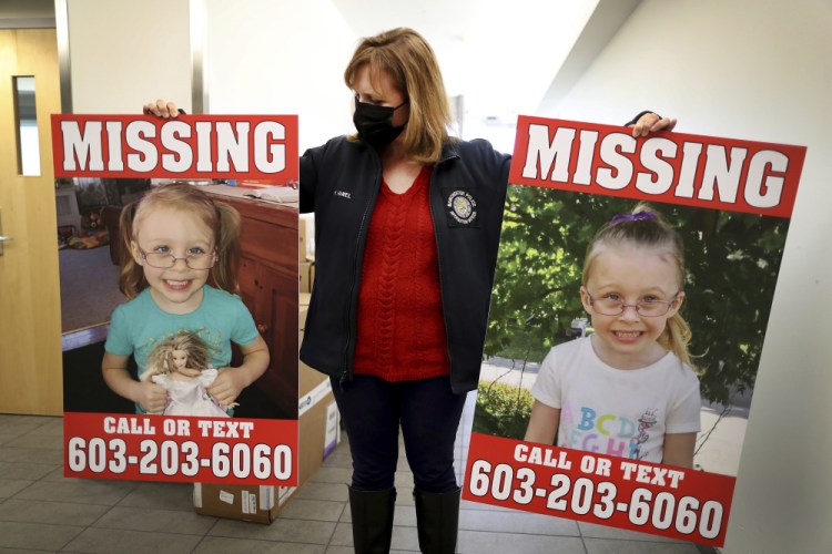 Manchester Police Public Information Officer Heather Hamel holds two reward posters, Tuesday, in Manchester, N.H., that show missing girl Harmony Montgomery. The father of the young girl, Adam Montgomery, 31, of Manchester, has been arrested on second-degree assault, custody and child endangerment charges regarding his daughter, but the search for her continues.