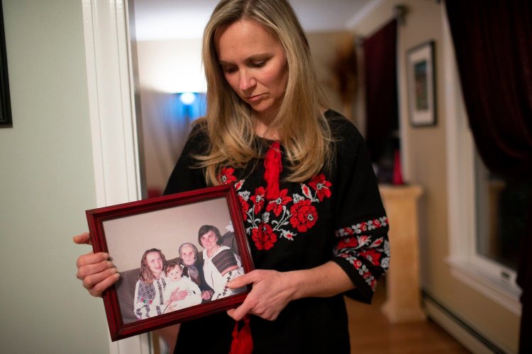 Lesya Stasiv of Yarmouth is worried about friends and family members in Ukraine, including her mother and father, who live in Lviv, and her uncle, who lives in Kyiv. On Friday, she held a photograph of herself with her daughter, Natalia, her grandmother and her mother.