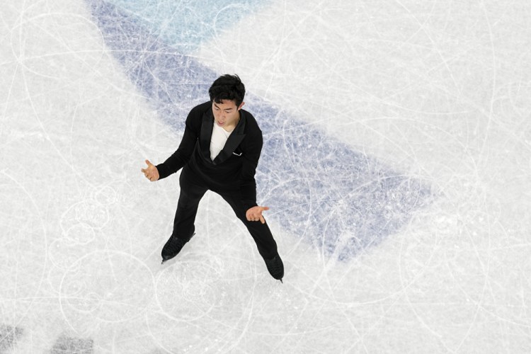 Nathan Chen, of the United States, competes during the men's singles short program team event in the figure skating competition at the 2022 Winter Olympics. 