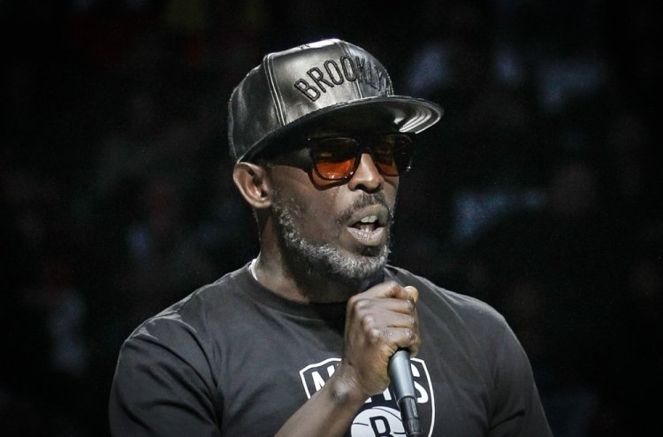 Actor Michael K. Williams introduces the Brooklyn Nets for an NBA game in 2014. A federal prosecutor said Wednesday that four men have been charged in Williams’ overdose death.