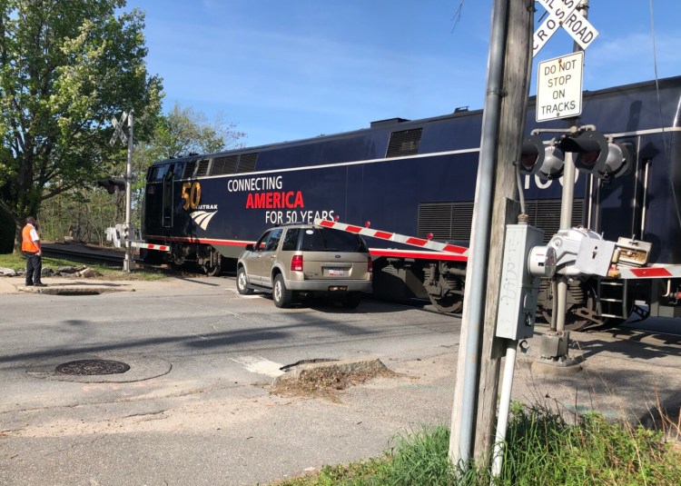 Police, fire and ambulance crews responded when the Amtrak Downeaster and an SUV collided Saturday afternoon near Woodfords Corner in Portland.