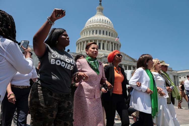 Democratic lawmakers take part in an abortion rights rally outside the Capitol on Tuesday. At least 17 House Democrats were arrested during the demonstration. MUST CREDIT: Photo for The Washington Post by Oliver Contreras