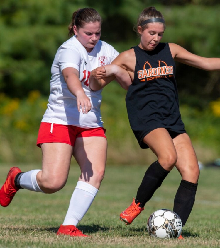 RICHMOND, ME - AUGUST 20: WiscassetÕs 18 Carolyn Potter, left, and GardinerÕs Abby Cooley passes during girls soccer play day Saturday August 20, 2022 at Richmond Middle/High School. (Staff photo by Joe Phelan/Staff Photographer)