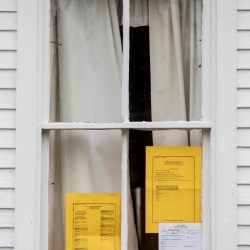Voters in Albany Township can see the ballot in the window of Albany Town hall