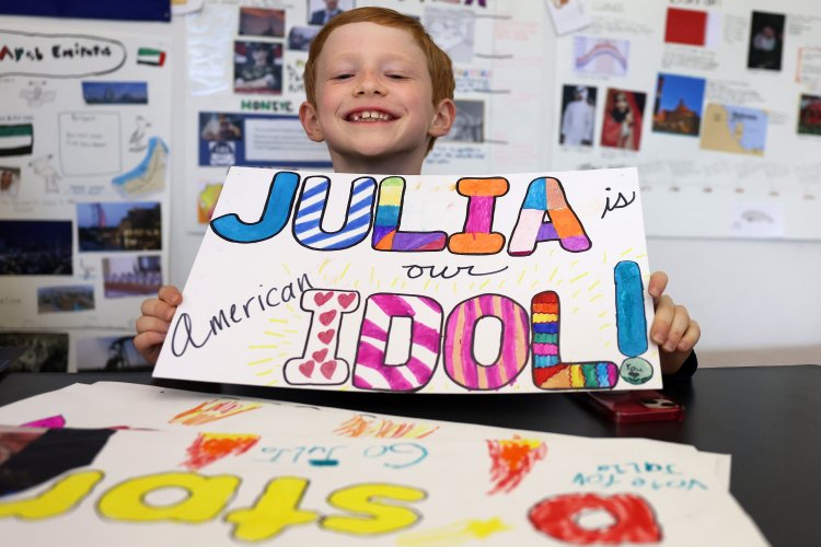North Yarmouth Academy second-grader William Cashman of Freeport shows off a sign of support for Julia Gagnon, one of the top contestants on this season of "American Idol." 