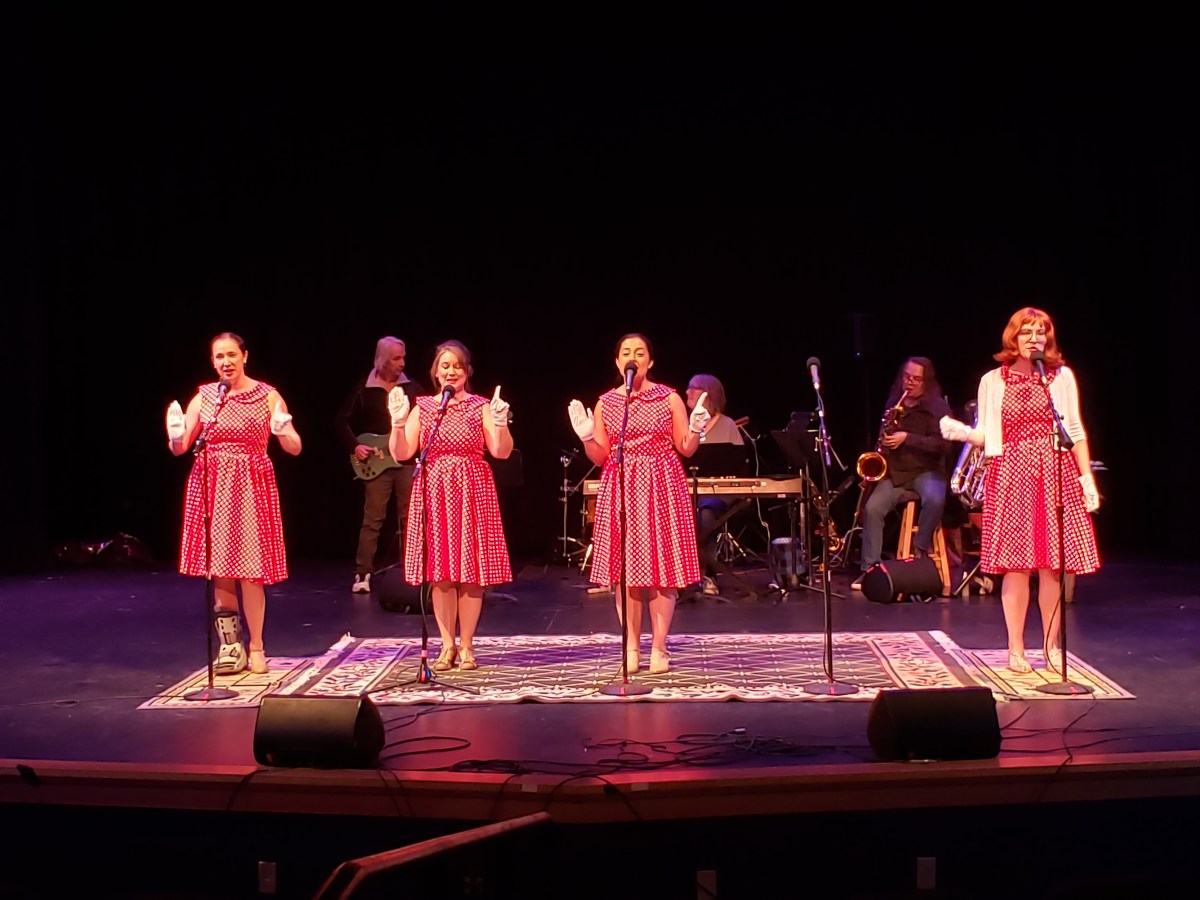 Photos from 2023 production, attached. (“Dyer Trouble” sketch) L to R:Judy Lloyd, Mike Powers, Ancy Mass, Joe Quinn, Jackie Stowell, John Paterson, Roey Reinen. (“Please, Mr. Postman” Photo with band) L to R singers: Erica Swan, Johannah DeGrandpre, Sarah Grinder, Kendall Penndorf, with band behind—Earl Bigelow, Marcia Gallagher, Parker Kenyon.